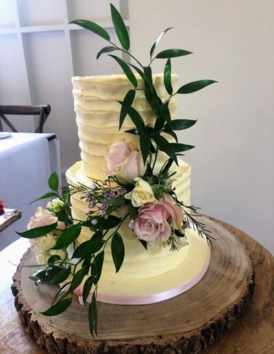 Luxury wedding cakes, Henley on Thames rustic buttercream cake with fresh flowers